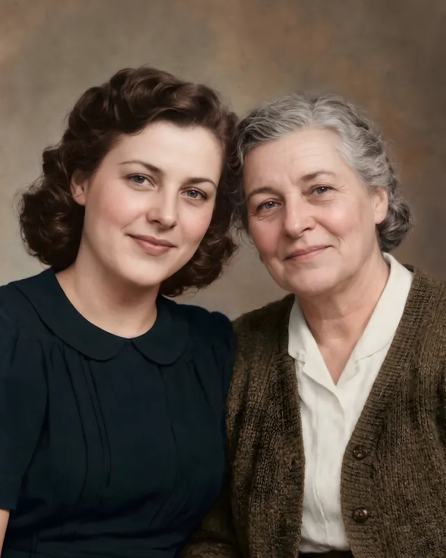 A mother and her grown daughter in a studio, after: the print restored and colorized.